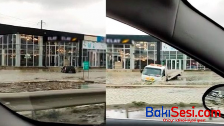 Bakıda suda batmış maşını çıxarmağa gələn evakuator da suda ilişib qaldı - VİDEO
